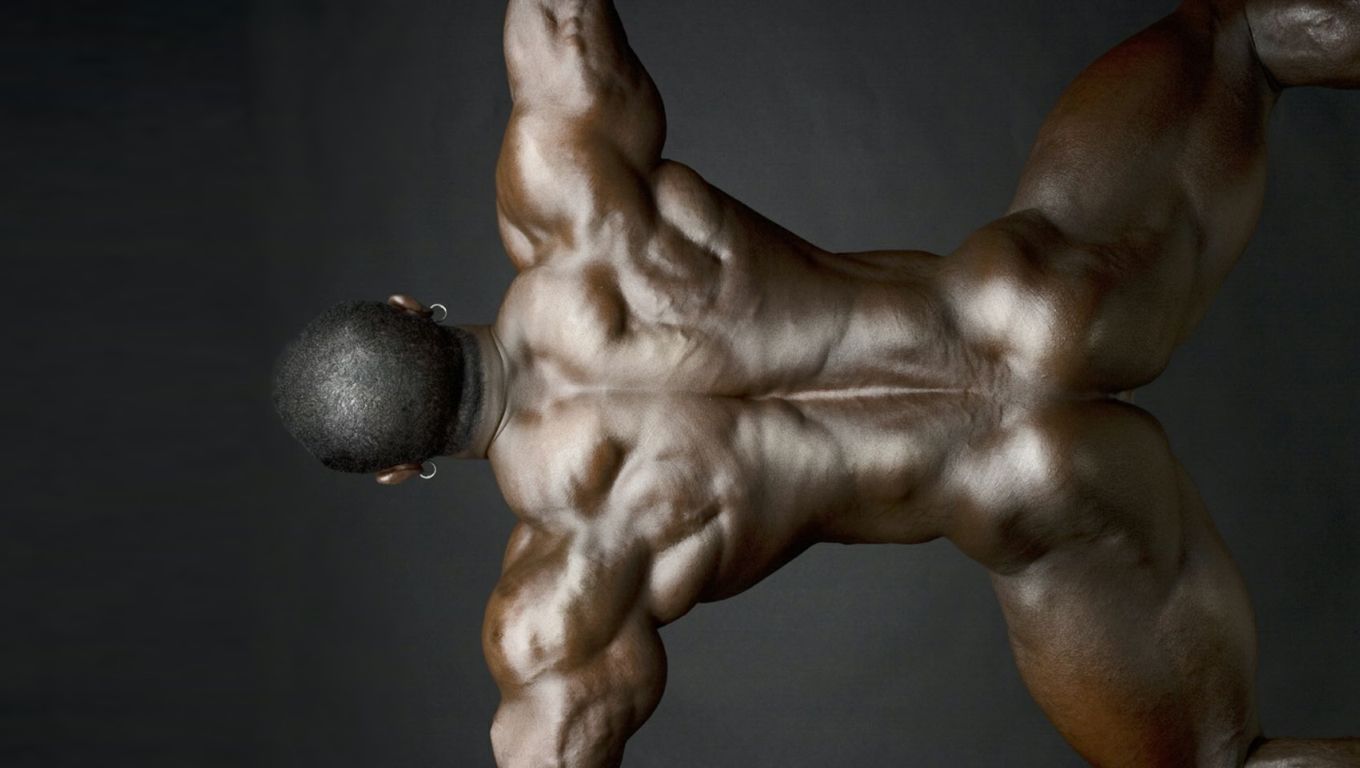 Rearview of Naked Black Bodybuilder.
