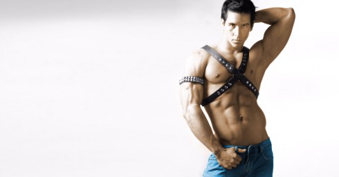 Bodybuilder in Leather Harness and Bluejeans