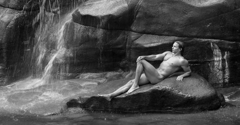 Black and White Muscular Stud Naked on a Rock in a Waterfall