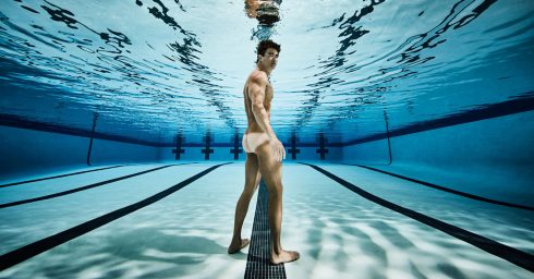 Rearview Athletic Guy Standing in a Pool