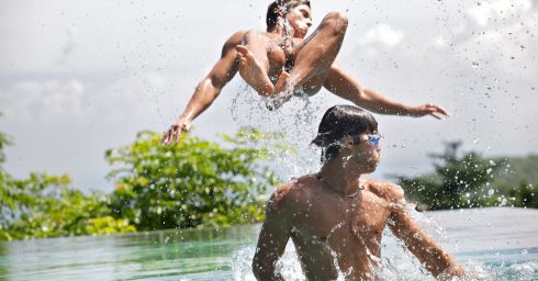 Two Young Guys Playing in the Lake