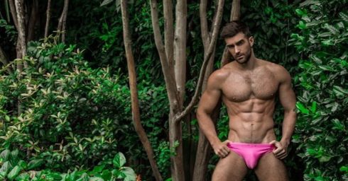 Fit Hunk in a Pink Bikini in the Woods