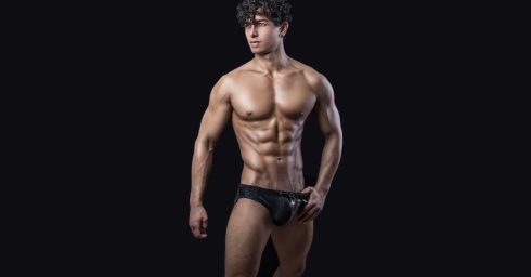 Ripped Young Guy in a Dark Bikini