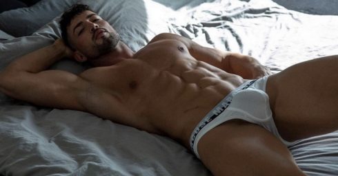 Athletic Guy Wearing White Marcuse Briefs in Bed