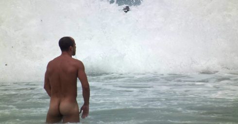 Rearview Naked Hunk in the Waves