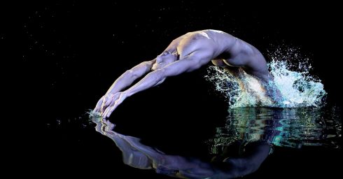 Fit Guy Naked in a Pool Making a Nice Splash