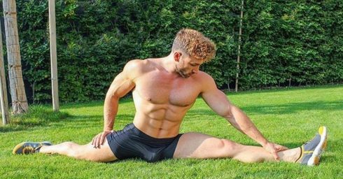 Athletic Guy in Black Shorts Doing the Splits