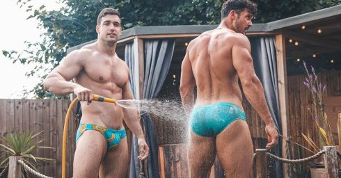 Two Muscular Young Hunks in Turquoise Bikinis