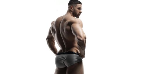 Rearview Muscular Hunk in Grey Briefs