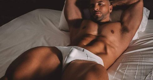 Muscular Young Guy Wearing White JJ Malibu Briefs in Bed