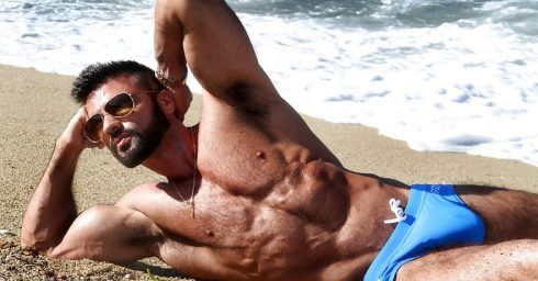 Athletic Hunk in a Blue Bikini at the Beach