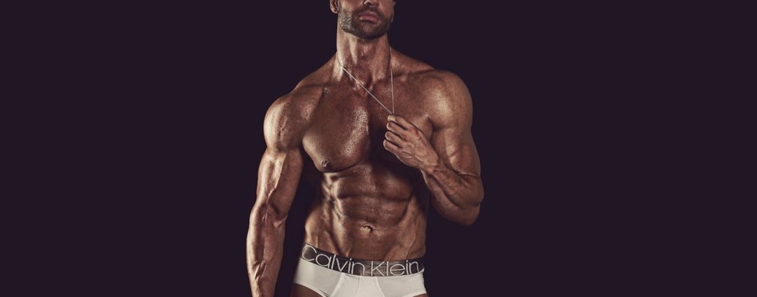 Muscular Hunk in White Calvin Klein Briefs