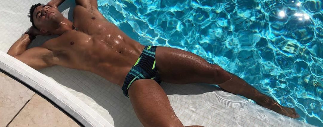 Muscular Hunk Relaxing at the Pool