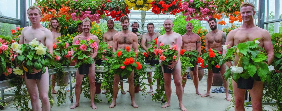 Twelve Naked Guys in a Greenhouse with Flowering Plants