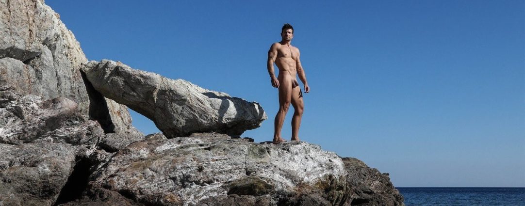 Full-Frontal Fit Guy on a Rock by the Ocean