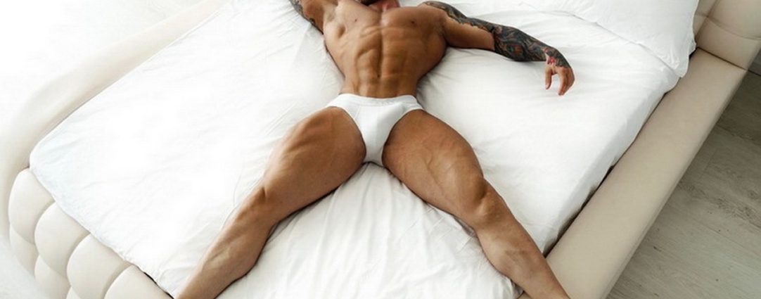 Muscular Stud Wearing White Briefs in Bed