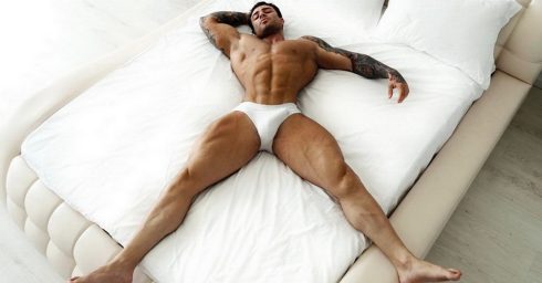 Muscular Stud Wearing White Briefs in Bed