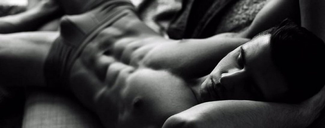 Black and White Ripped Guy Wearing Briefs on a Sofa