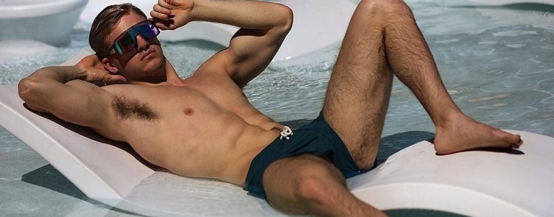 Fit Guy Lounging in a Pool