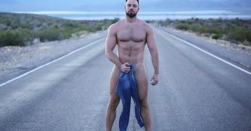 Naked Hunk in the Middle of a Road