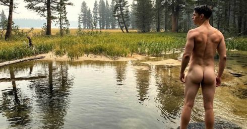 Rearview Athletic Guy Naked in a Stream