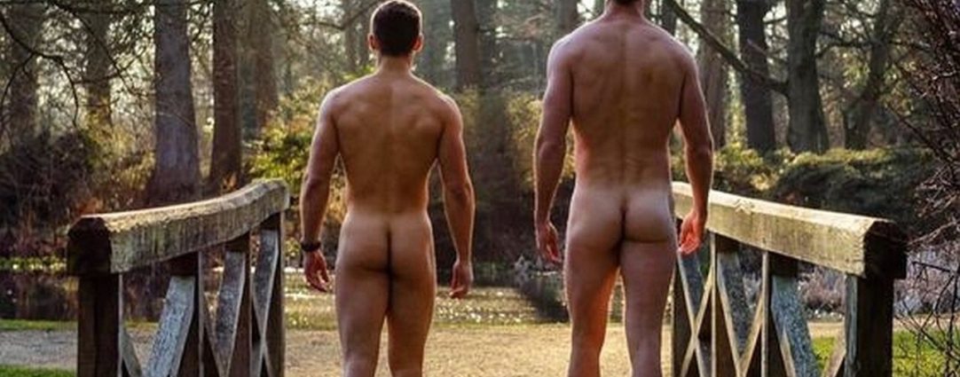 Rearview Two Naked Guys on a Footbridge in the Woods