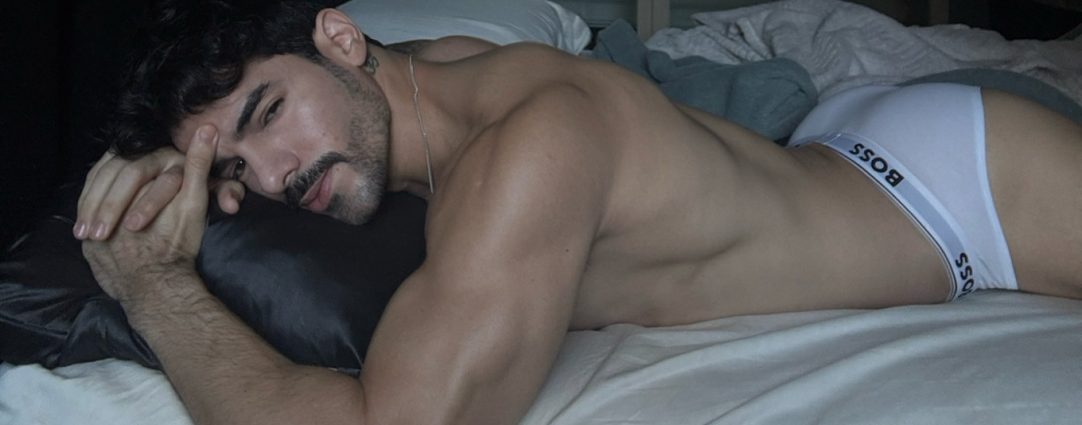 Athletic Guy with a Nice Ass Wearing White Boss Briefs in Bed