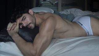 Athletic Guy with a Nice Ass Wearing White Boss Briefs in Bed