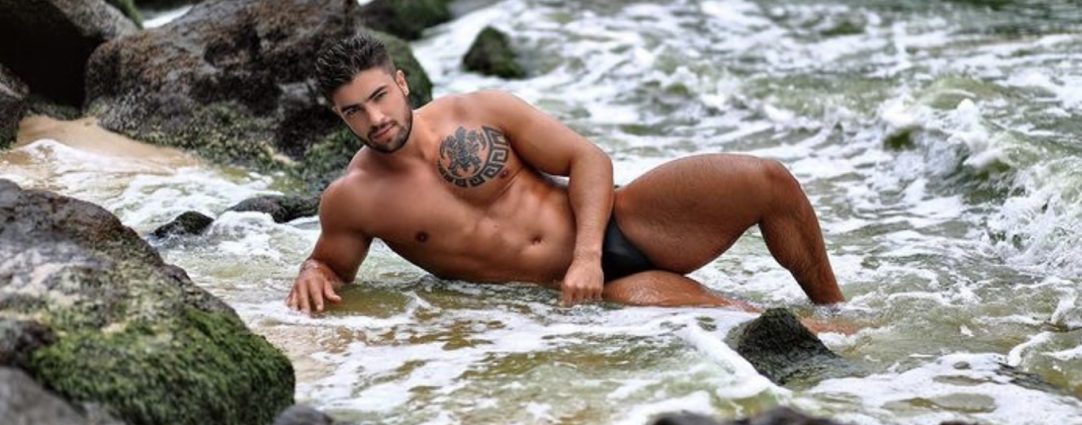 Athletic Hunk by Some Rocks at the Waters Edge