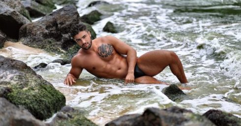 Athletic Hunk by Some Rocks at the Waters Edge