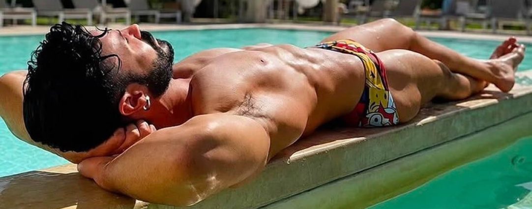 Athletic Guy Relaxing by a Pool