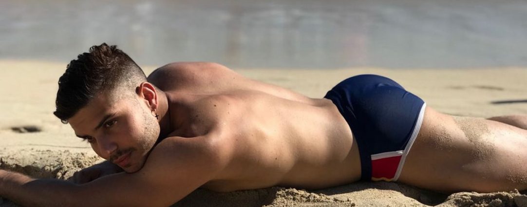 Athletic Guy in a Blue Bikini at the Beach
