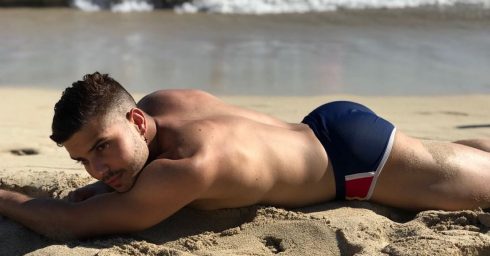 Athletic Guy in a Blue Bikini at the Beach