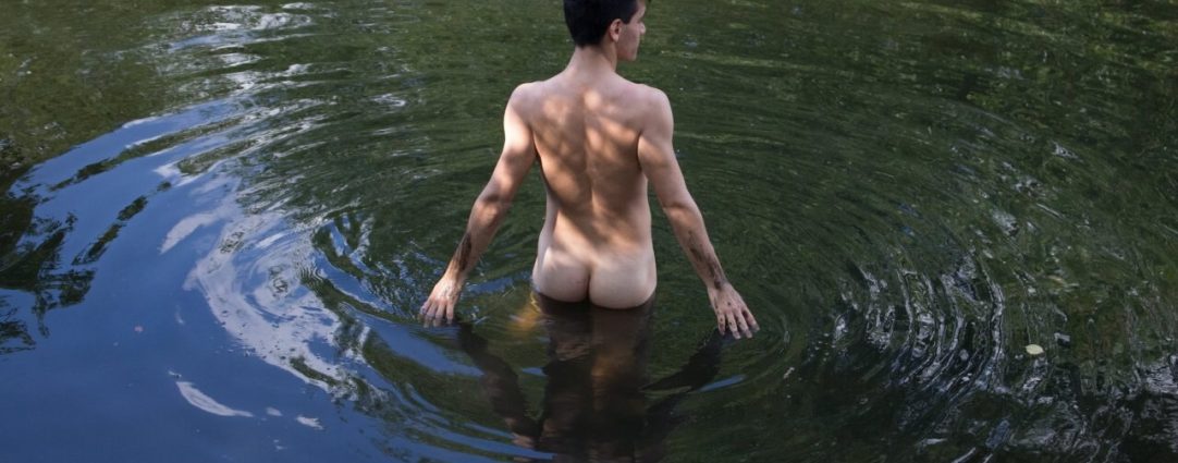 Rearview Young Guy Naked in a Lake