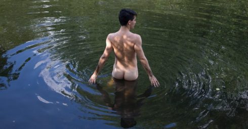 Rearview Young Guy Naked in a Lake