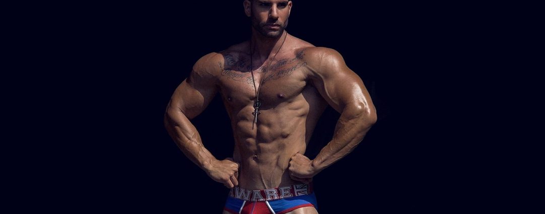 Muscular Hunk in Red and Blue Briefs