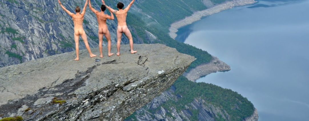 Rearview Three Naked Guys on a Rock Overhanging a Valley