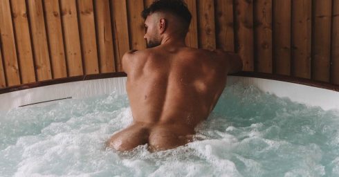 Rearview Athletic Guy Naked in a Hot Tub