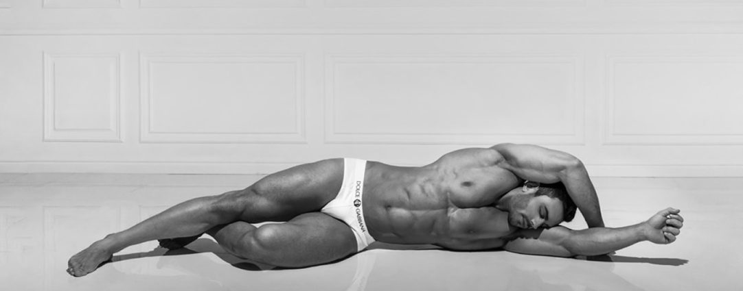 Black and White Fit Guy in White Dolce & Gabbana Briefs Lying on the Floor