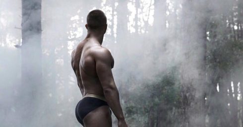 Rearview Muscular Stud in Dark Briefs in the Woods