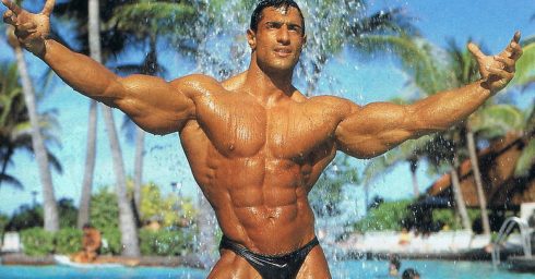 Bodybuilder in a Black Bikini at a Pool